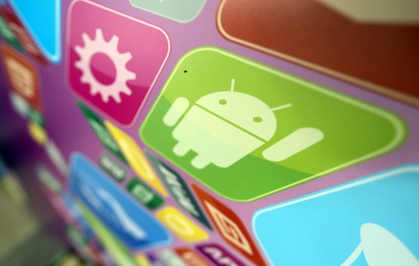 A logo for Google Inc.'s Android operating system is displayed on an advertising sign during the Apps World Multi-Platform Developer Show in London, U.K., on Wednesday, Oct. 23, 2013. Retail sales of Internet-connected wearable devices, including watches and eyeglasses, will reach $19 billion by 2018, compared with $1.4 billion this year, Juniper Research said in an Oct. 15 report. Photographer: Chris Ratcliffe/Bloomberg via Getty Images